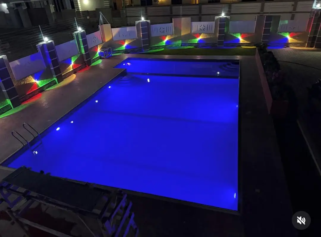 Pool with underwater lighting at night in Dodoma