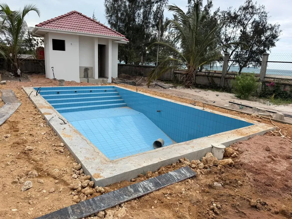 Beachside pool at tiling stage in Kigamboni