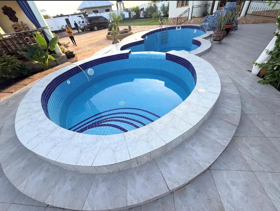 Oval pool with stepped entry in Mbutu, Kigamboni