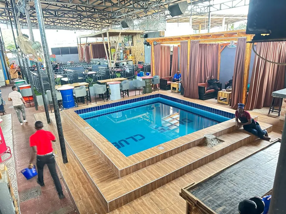Club pool with a timber deck in Mwenge